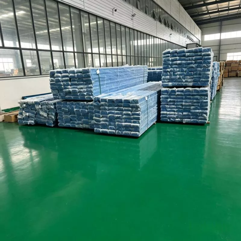 Finished products with blue film packaging on shelves, awaiting delivery from the warehouse workshop